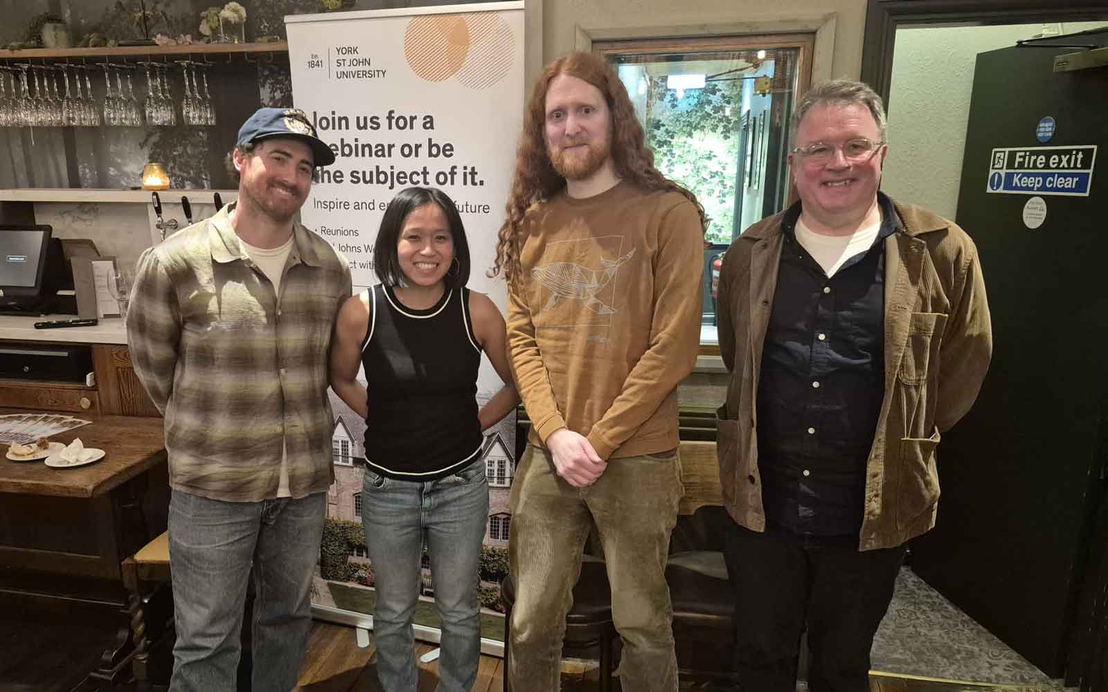 Four individuals at the YSJ London Network event in 2025.