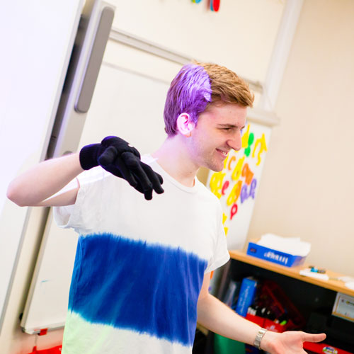 Student teacher using hand puppet