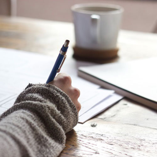 Close up of someone's hand holding a pen.